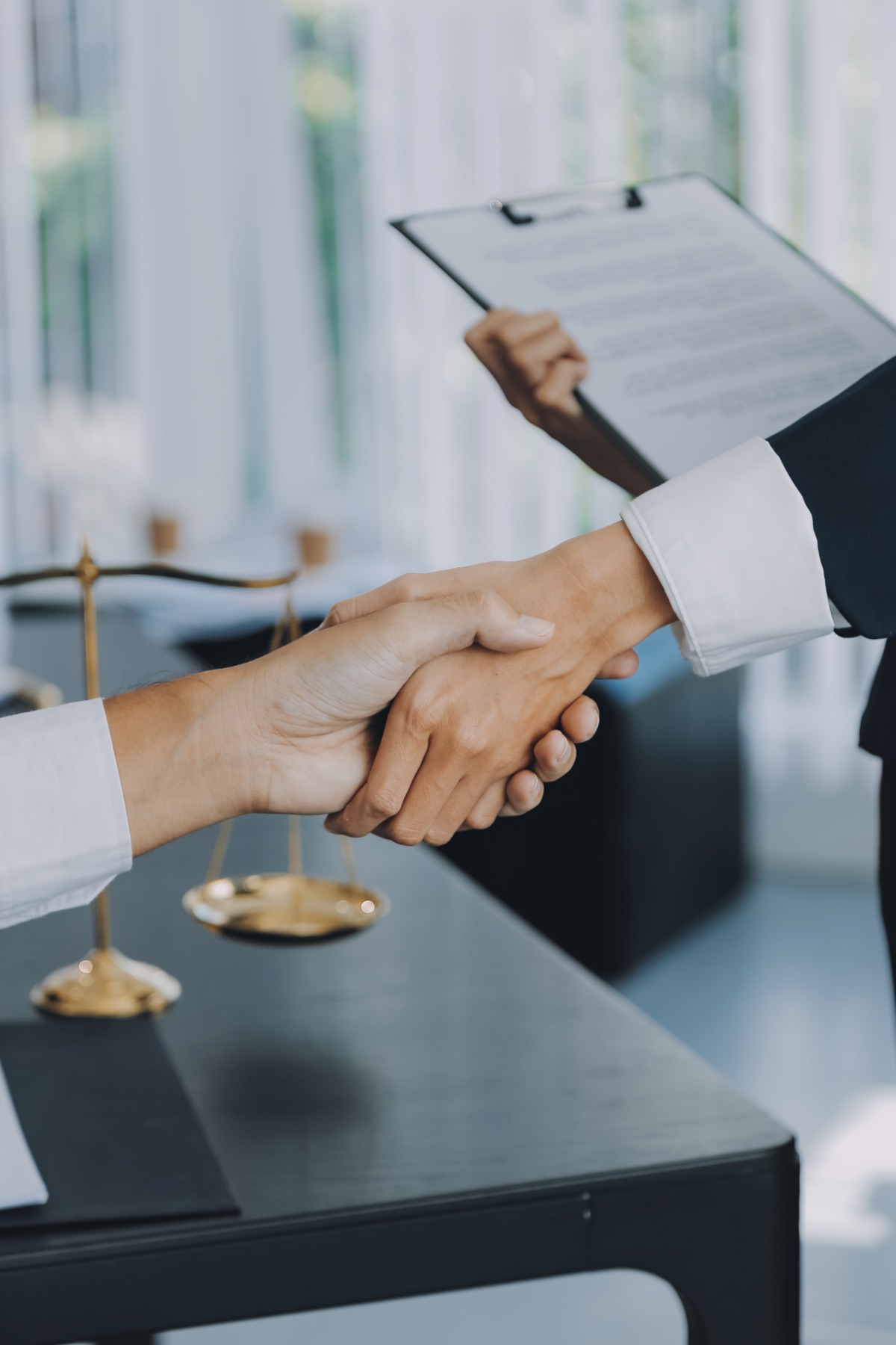 businessman-shaking-hands-seal-deal-with-his-partner-lawyers-attorneys-discussing-contract-agreement